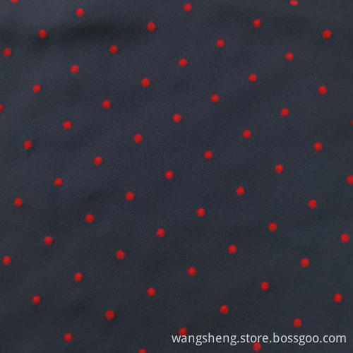 100% Polyester moss crepe with Red flocking
